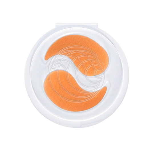 Augustinus Bader The Eye Patches in a translucent clamshell container, showing the teardrop shape of the product.