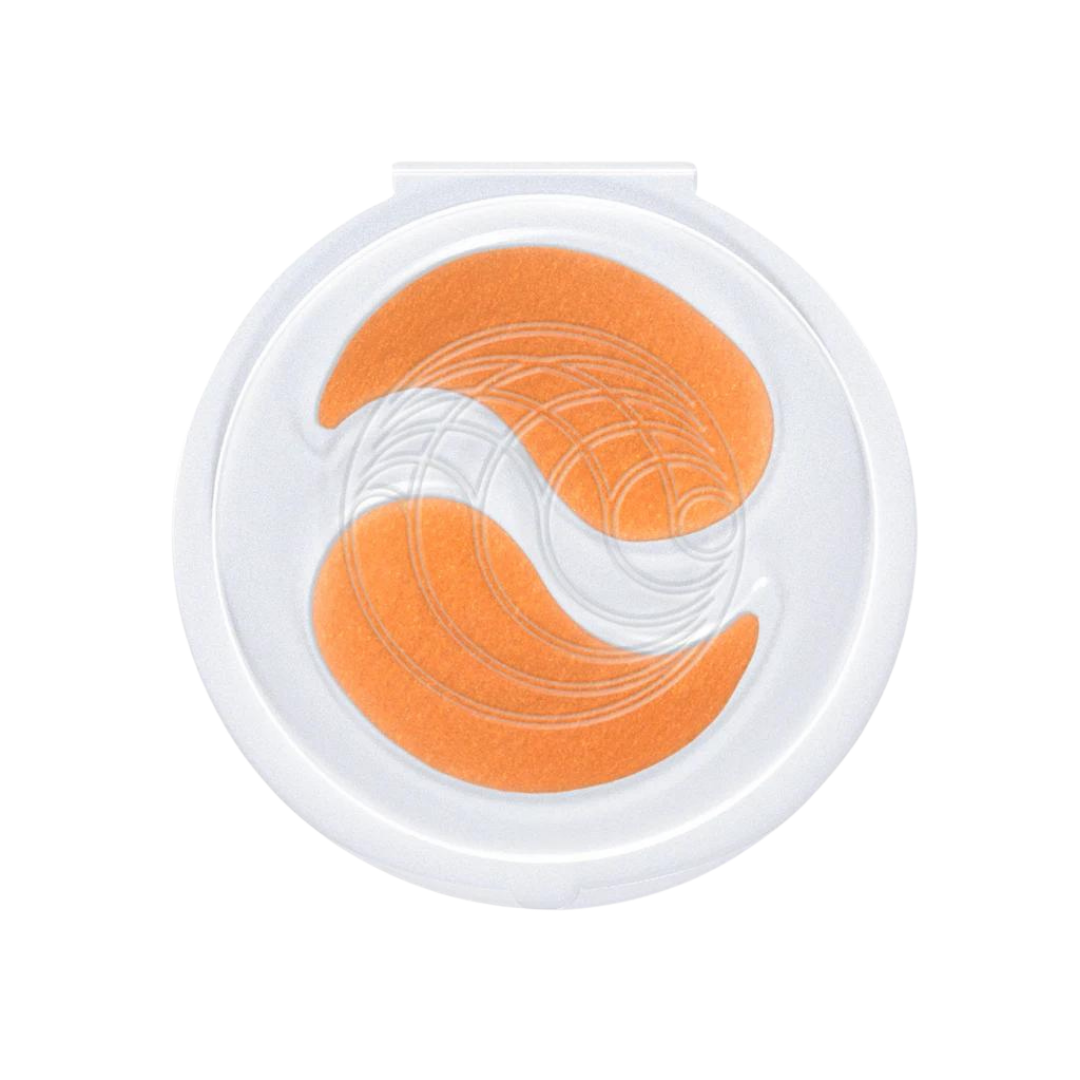 Augustinus Bader The Eye Patches in a translucent clamshell container, showing the teardrop shape of the product.