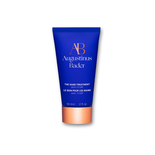 Augustinus Bader The Hand Treatment — cobalt blue tube with copper cap, standing upright on a white background.