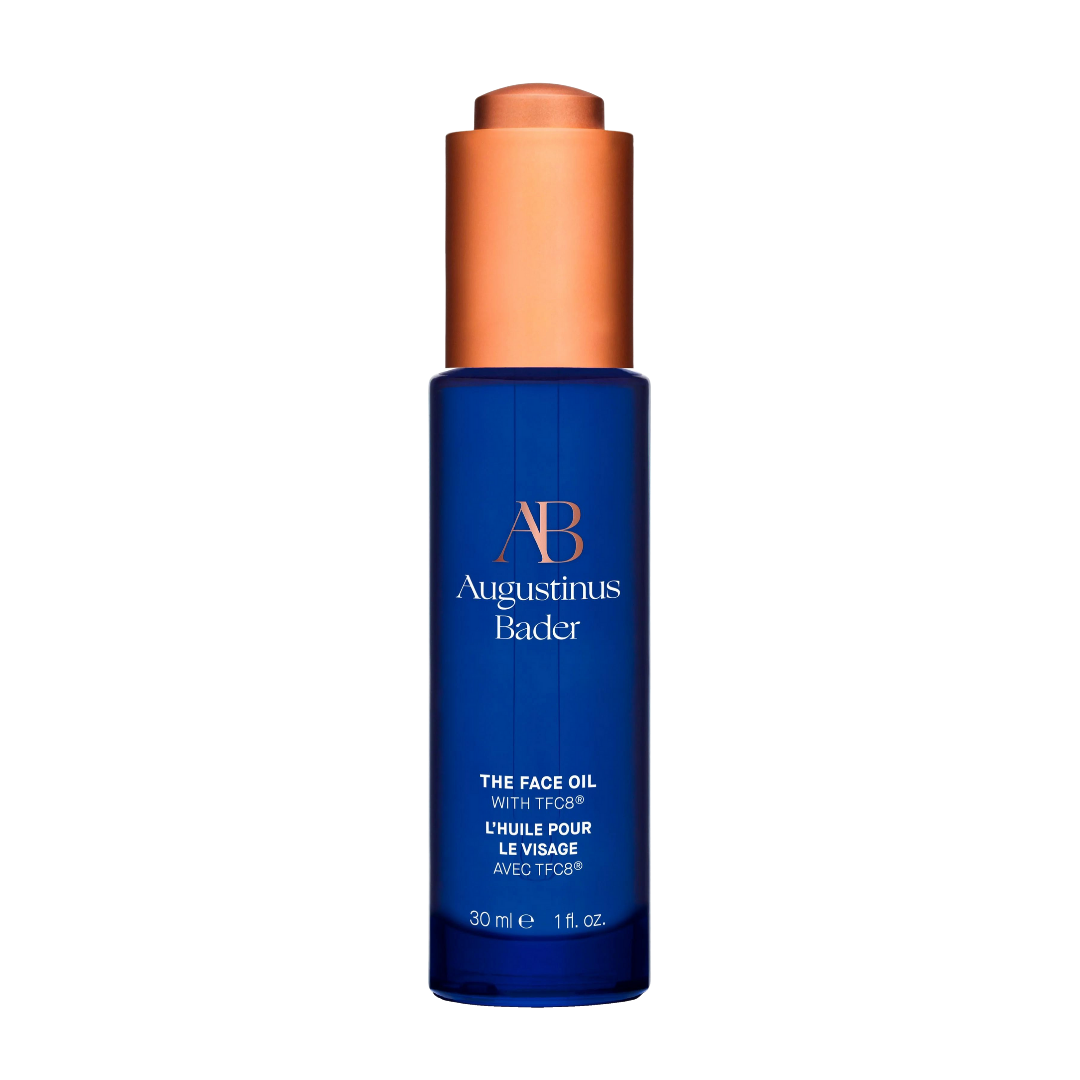Augustinus Bader The Face Oil — cobalt blue bottle with copper dropper, shown upright on a clean white background.