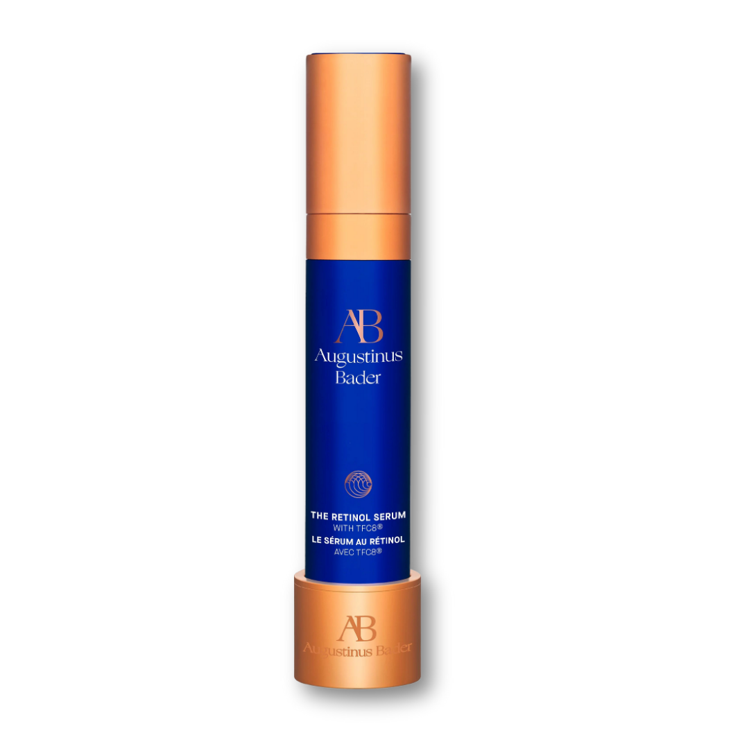Augustinus Bader The Retinol Serum — cobalt blue bottle with copper pump dispenser, displayed upright on a clean white background.